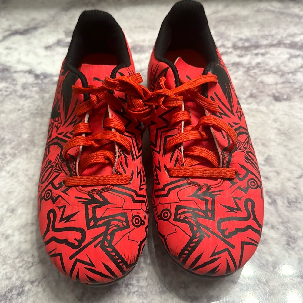 Youth red and black Puma soccer cleats. Size 1